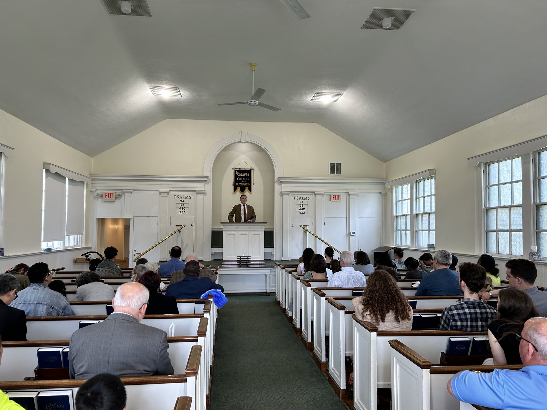 Worshippers gathered in the sanctuary as the pastor preaches